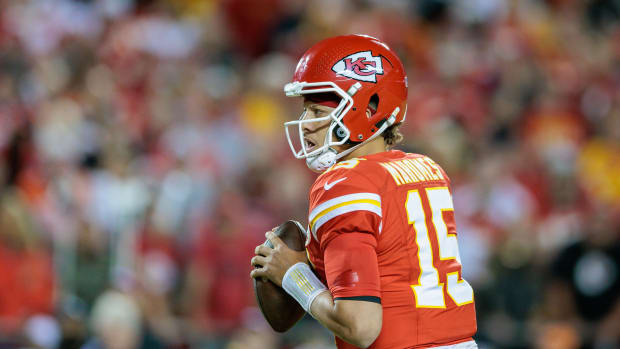 Patrick Mahomes looks to pass against the Denver Broncos.